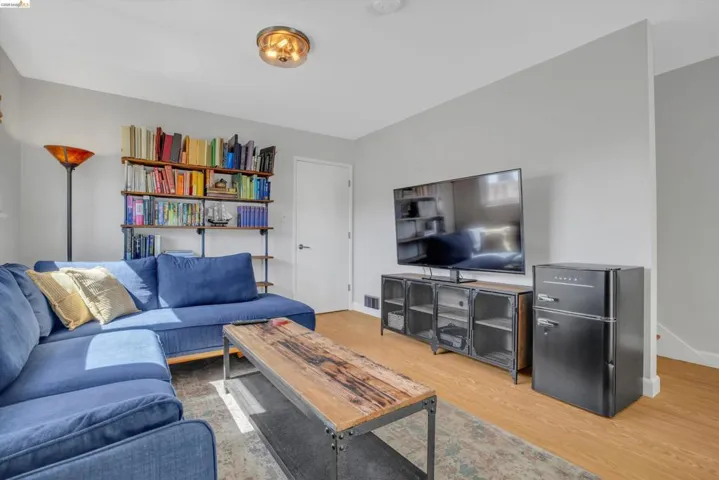 Living room featuring light wood-style​​‌​​​​‌​​‌‌​​‌​​​‌‌​​​‌​​‌‌​​‌‌​​‌‌​​​​ flooring