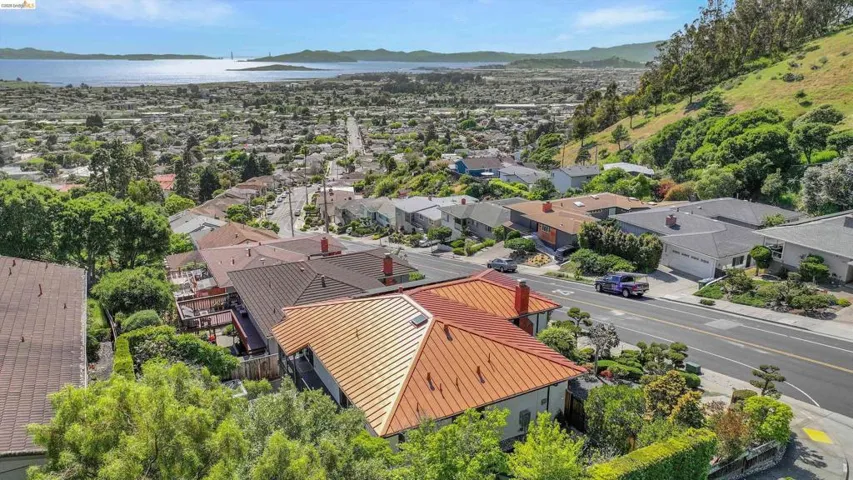 Aerial perspective of suburban area featuring a mountainous background