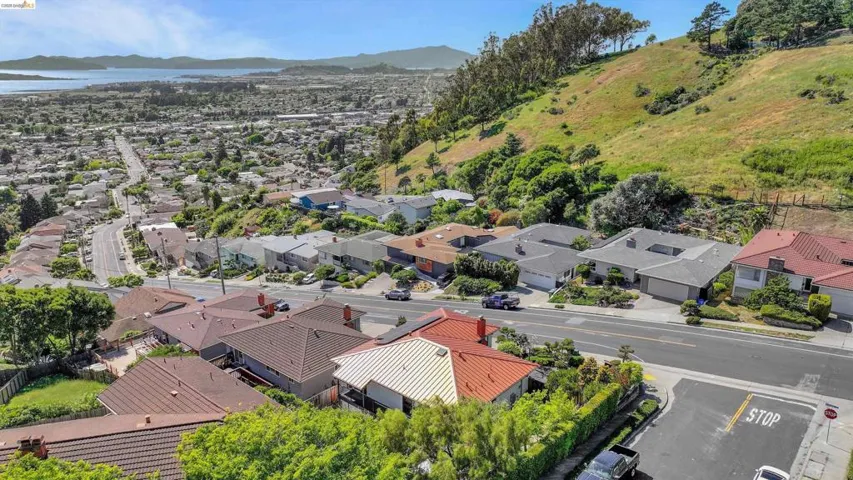 Aerial perspective of suburban area with a mountain backdrop