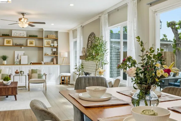 Dining room featuring light wood-style flooring, a ceiling fan, and recessed lighting