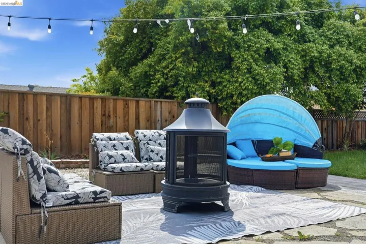Fenced backyard with outdoor seating