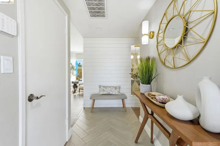 Corridor featuring parquet floors and wooden walls