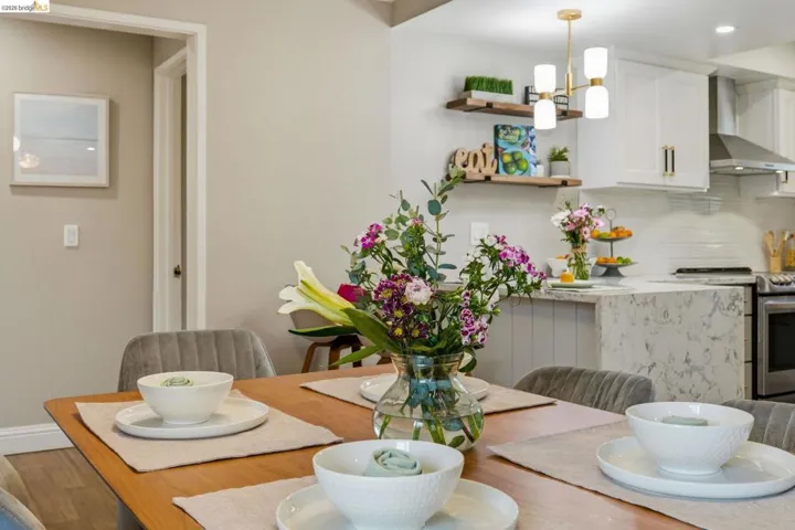 Dining space featuring suspended lighting and light wood finished floors