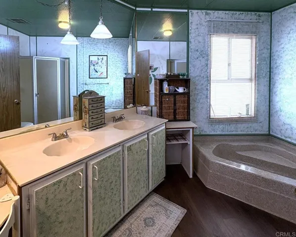 Dual sink vanity and soaking tub