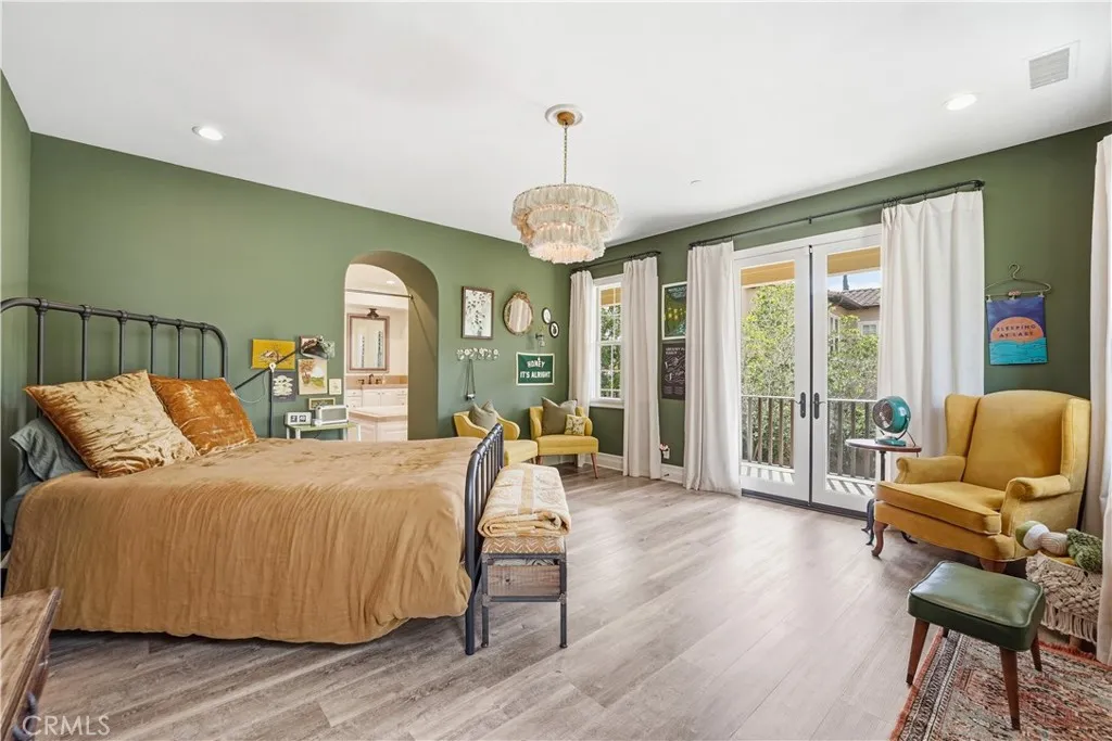 Primary Suite with Balcony overlooking backyard pool