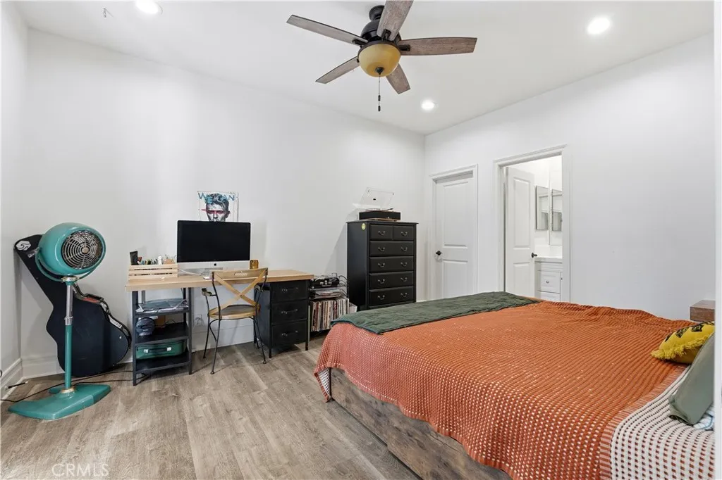 Bedroom with mini balcony and view of side courtnyard