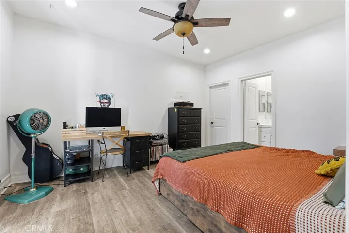 Bedroom with mini balcony and view of side courtnyard