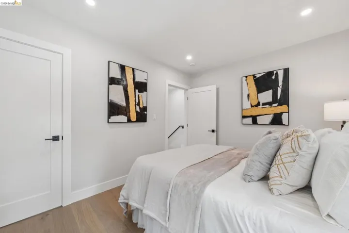 Bedroom featuring wood finished floors and recessed lighting
