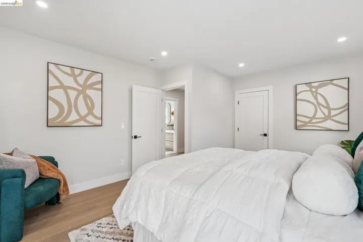Bedroom featuring wood finished floors and recessed lighting