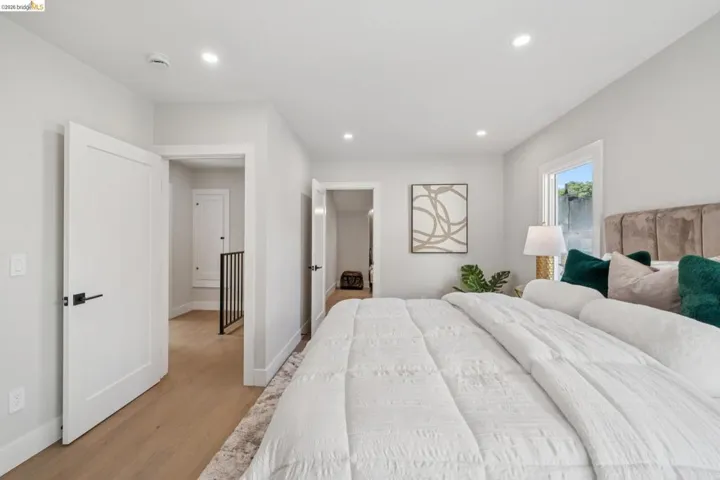 Bedroom featuring light wood-style flooring and recessed lighting