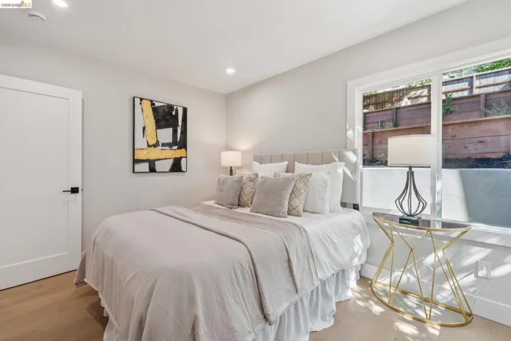 Bedroom with wood finished floors and recessed lighting
