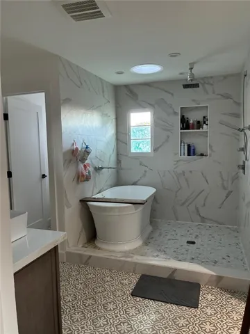 Master bedroom shower and bathtub