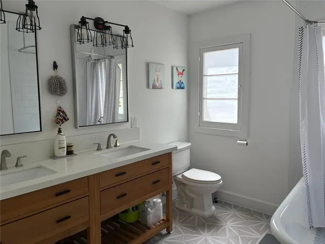 Downstairs - guest bathroom, double sinks and bath tub