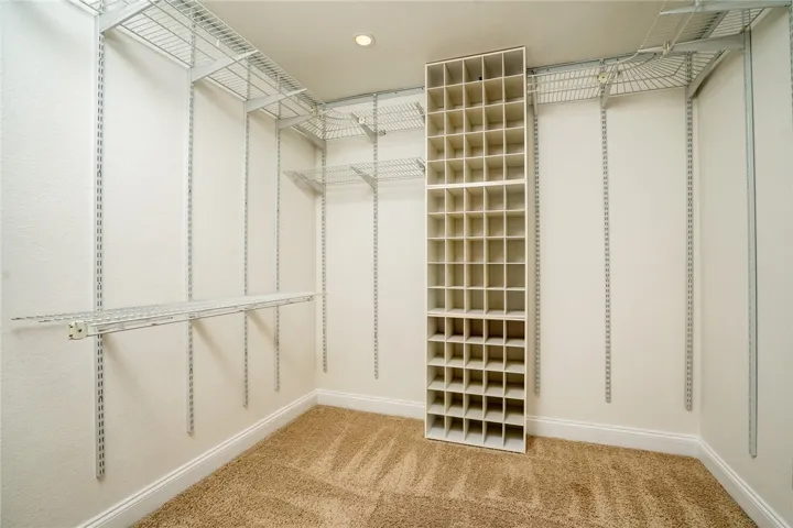 Upstairs primary bedroom walk-in closet!
