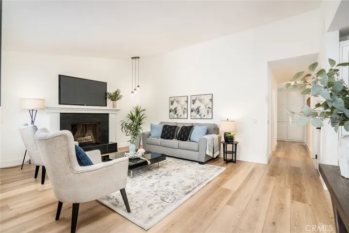 The formal living room has vaulted ceilings & fireplace!