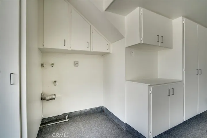 Fully finished garage w/lots of storage cabinets!