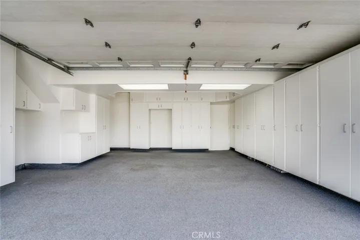 Fully finished garage w/lots of storage cabinets!