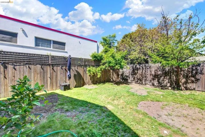 View of fenced backyard