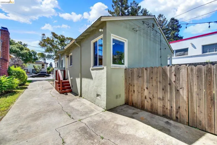 View of property exterior featuring crawl space and stucco siding