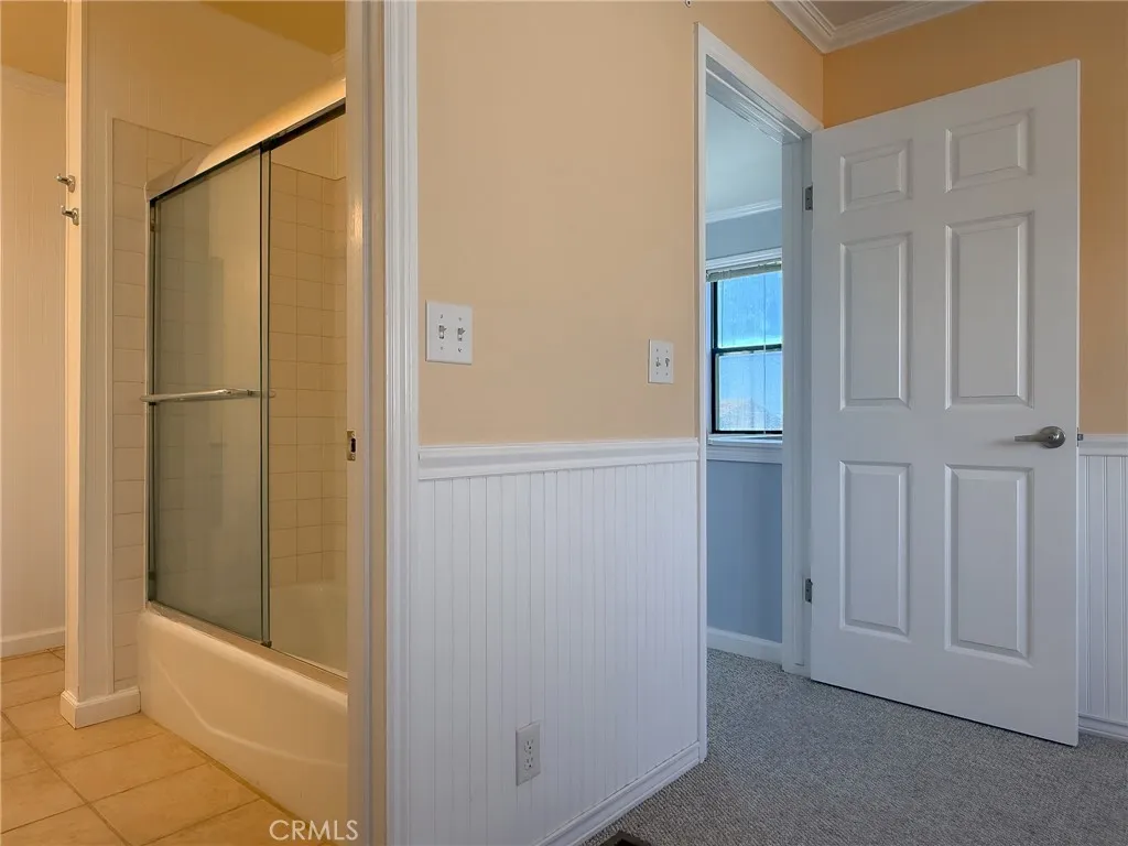 This bedroom offers direct access to the adjoining bathroom.