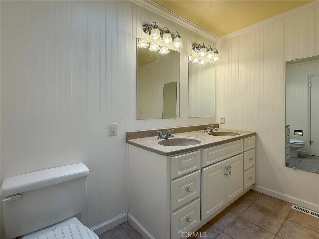 Bathroom featuring tiled flooring.
