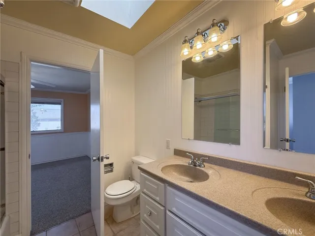 Upstairs full bathroom with dual sinks