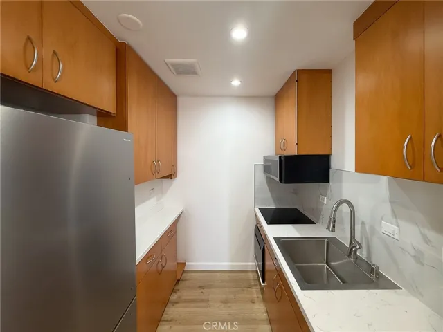 Full size new refrigerator and compact dishwasher.