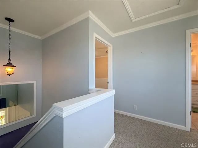 Top of the stairs with two bedrooms and bathroom.