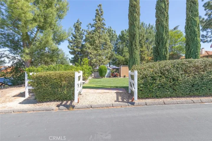 Side street gated entry to lower lot perfect for ADU, RV, Parties