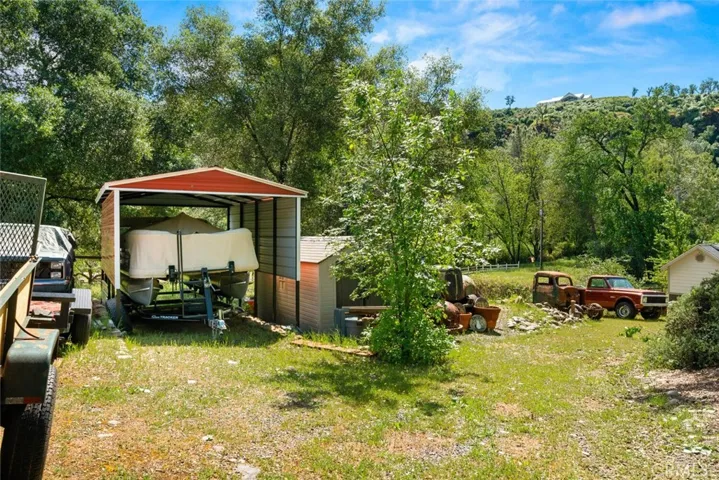 Carport from extended driveway to bottom portion of lot