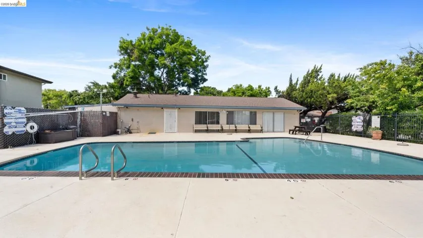 Community pool featuring a patio area