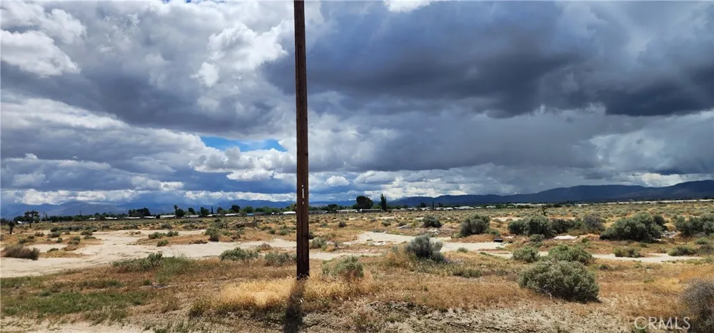 Electrical pole located on unpaved road