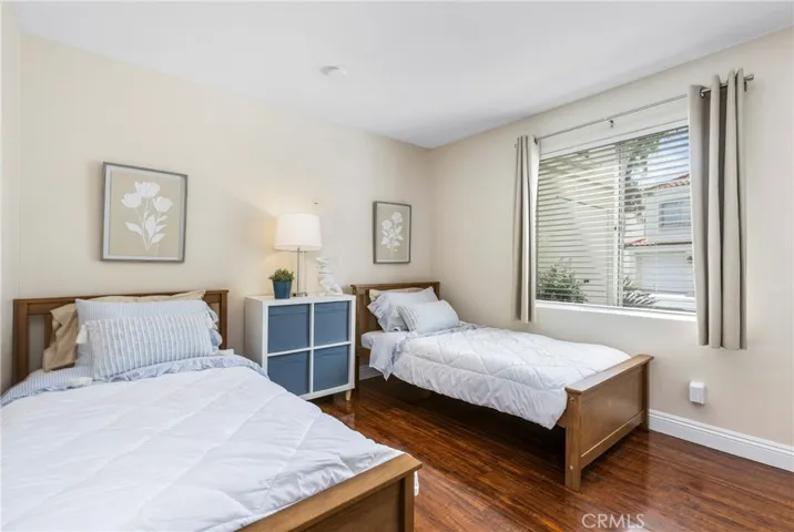 Spacious secondary bedroom easily accommodates two beds and new panel closet doors