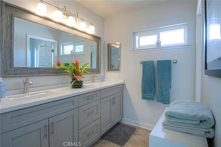 Elegant primary vanity and bath area