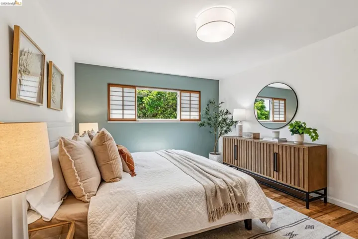 Bedroom featuring wood finished floors and baseboards