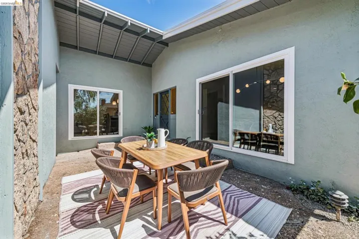 View of patio with outdoor dining area