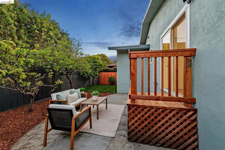 Fenced backyard featuring a patio and outdoor seating