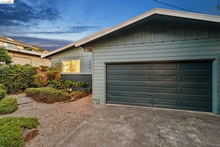Garage at dusk with driveway
