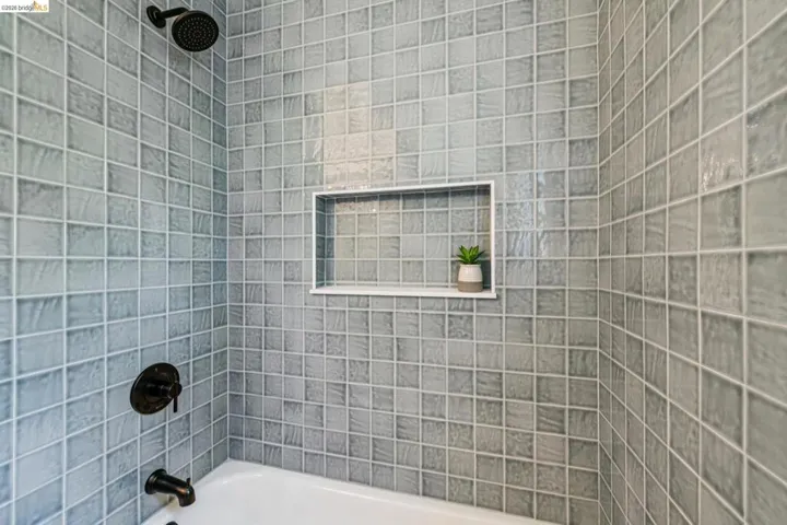 Full bathroom with shower / bath combination