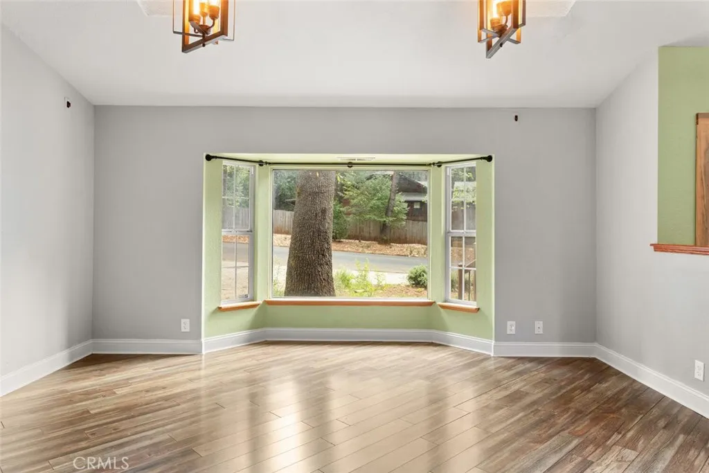 Large bay window in living room.