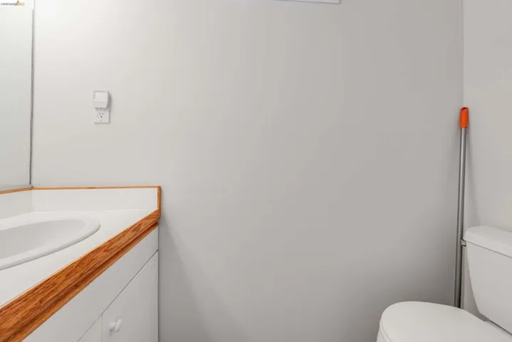 Half bath with vanity and toilet