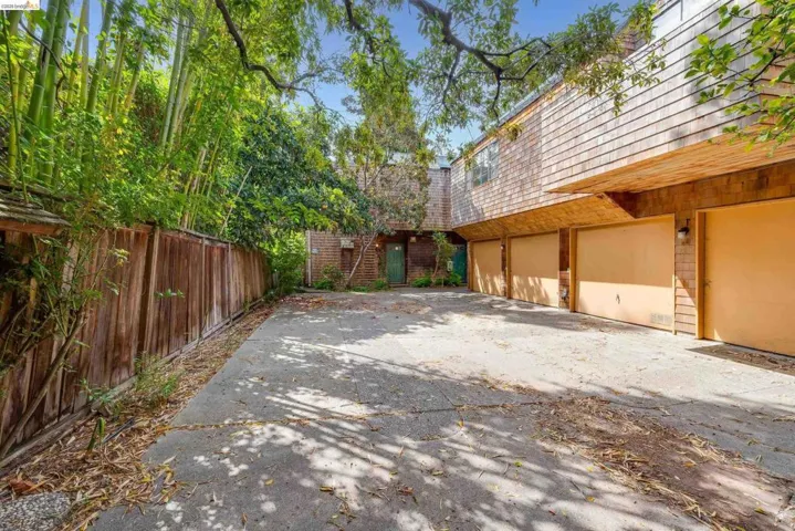 View of patio / terrace with concrete driveway and a garage