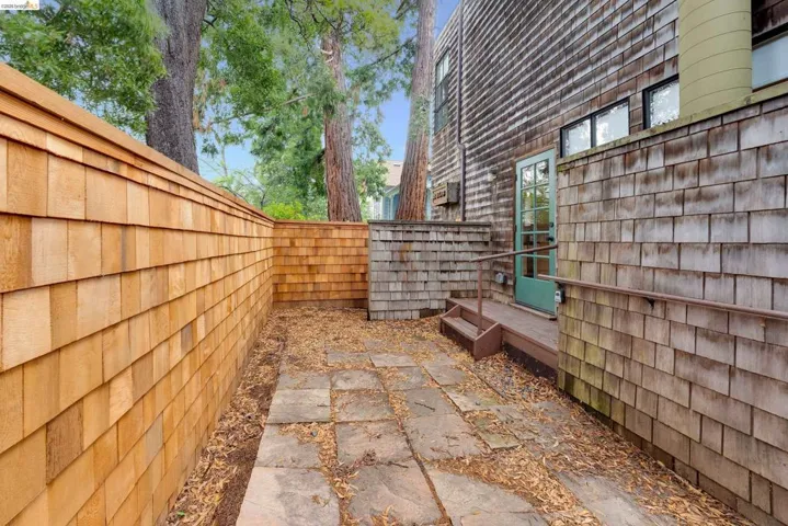 Fenced backyard with a wooden deck