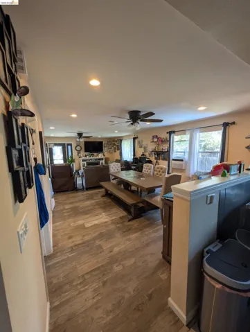 Dining space featuring plenty of natural light, dark wood finished floors, recessed lighting, and ceiling fan