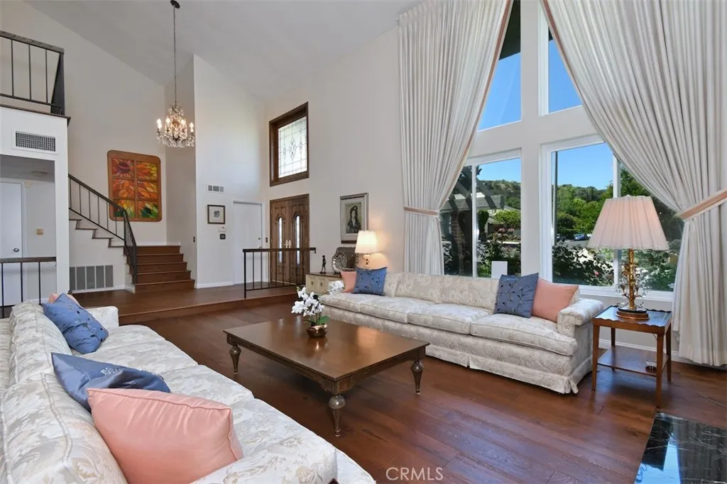 Living Room with view of Entry and Stairs