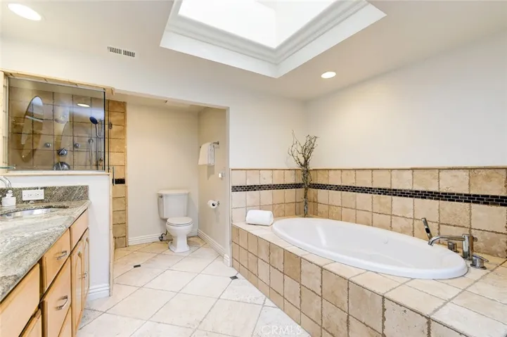 primary bathroom suite with jetted tub & shower