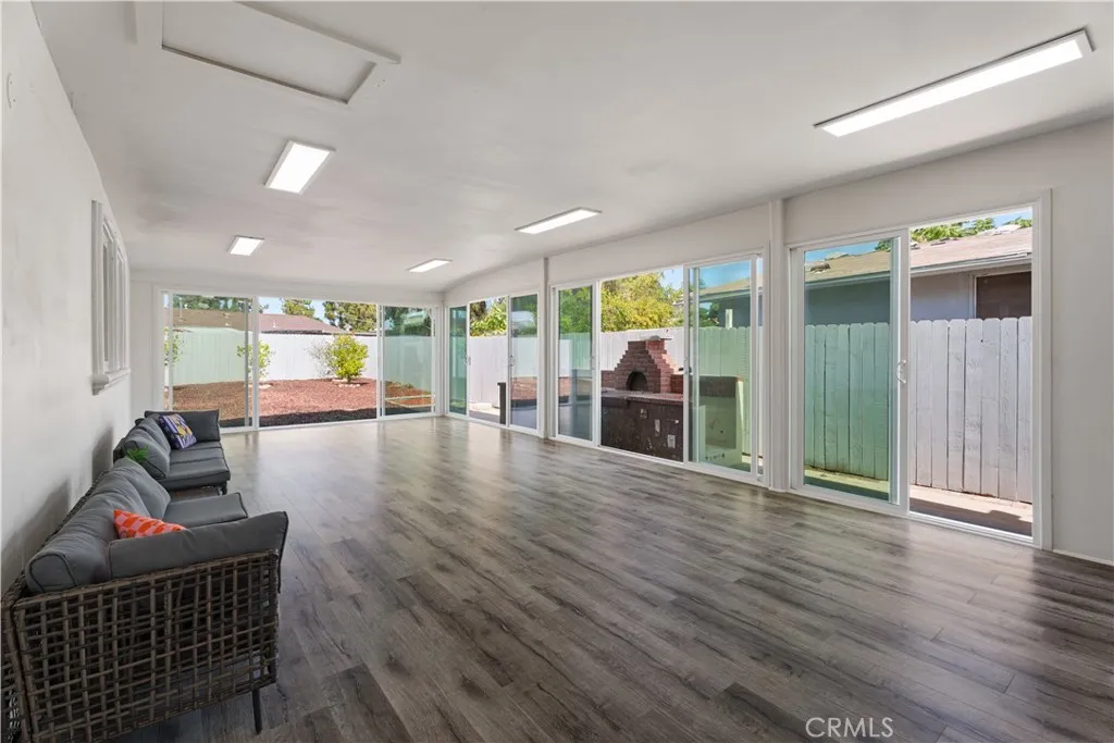 sun-room with all glass doors open