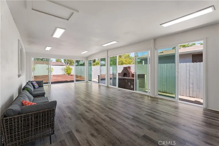 sun-room with all glass doors open