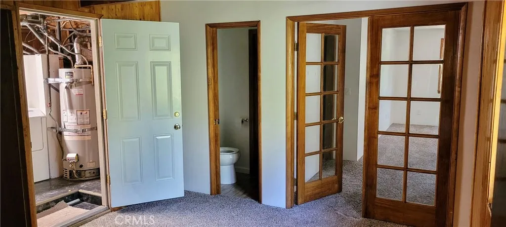 Open room entryway to laundry, bathroom, bedroom 3