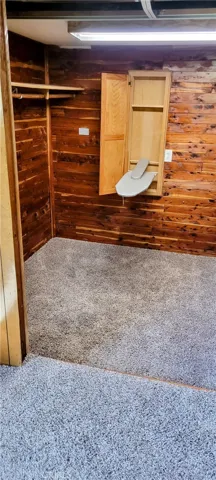Bedroom 2 walk-in closet with iron board
